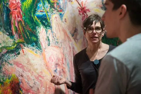 An adviser speaking to student